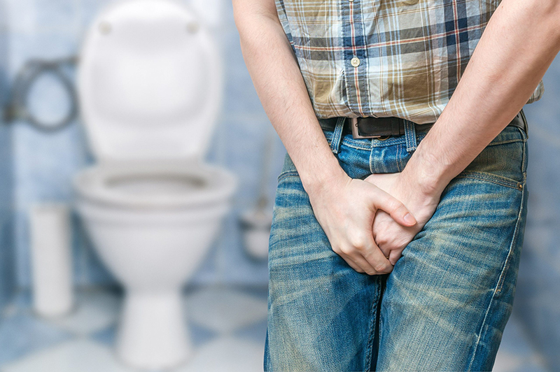 Tinh hoàn sưng to, cảm giác đau hoặc có triệu chứng cứng như đá